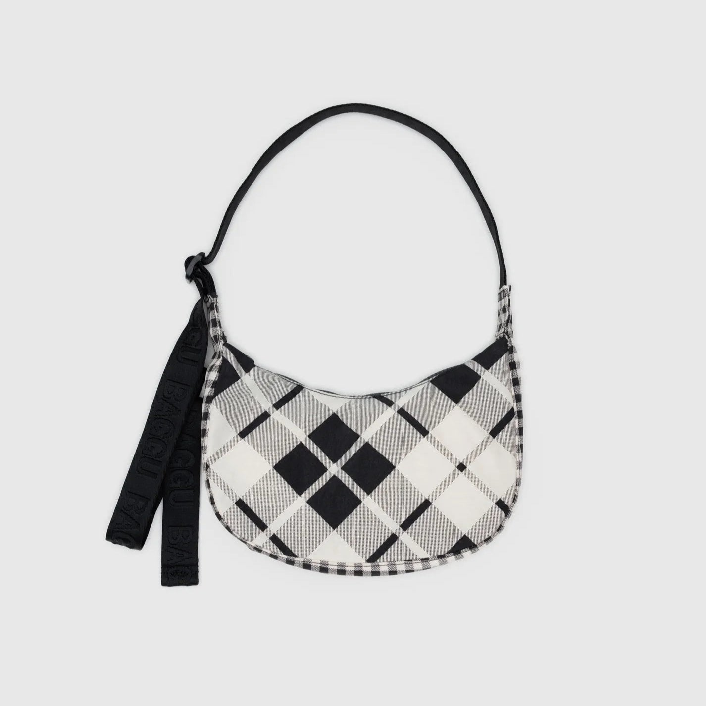 Black and white checkered bag with a strap on a light gray background