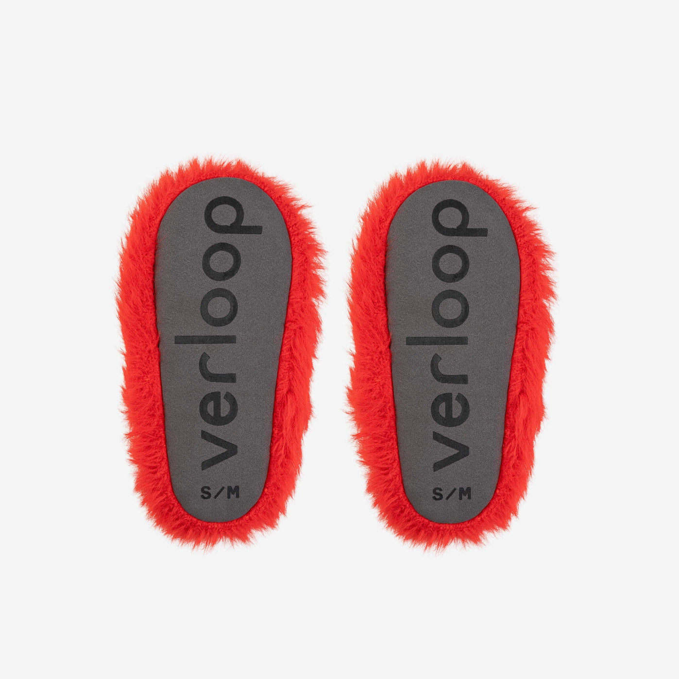 Two red slipper bottoms on a white background