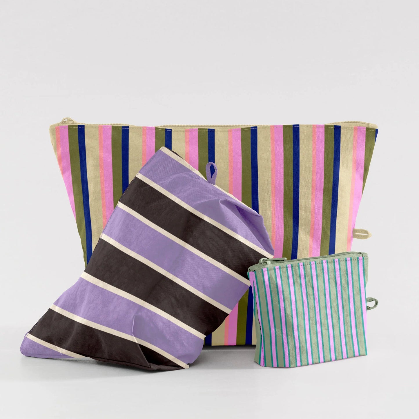 Striped bags in various colors on a light gray background