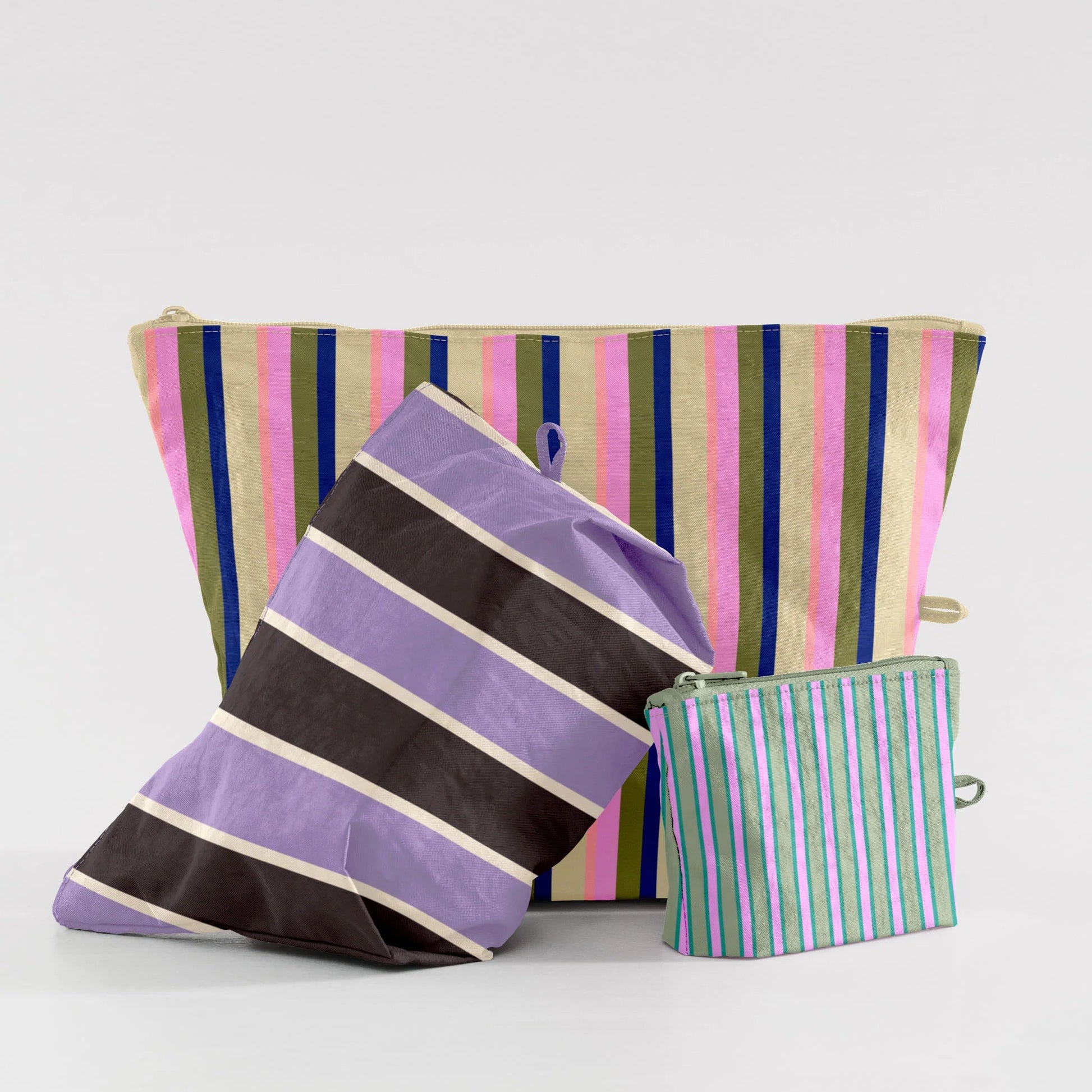 Striped bags in various colors on a light gray background