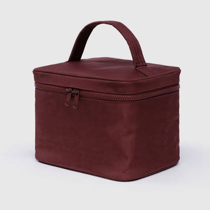 Brown travel case with handle on a white background