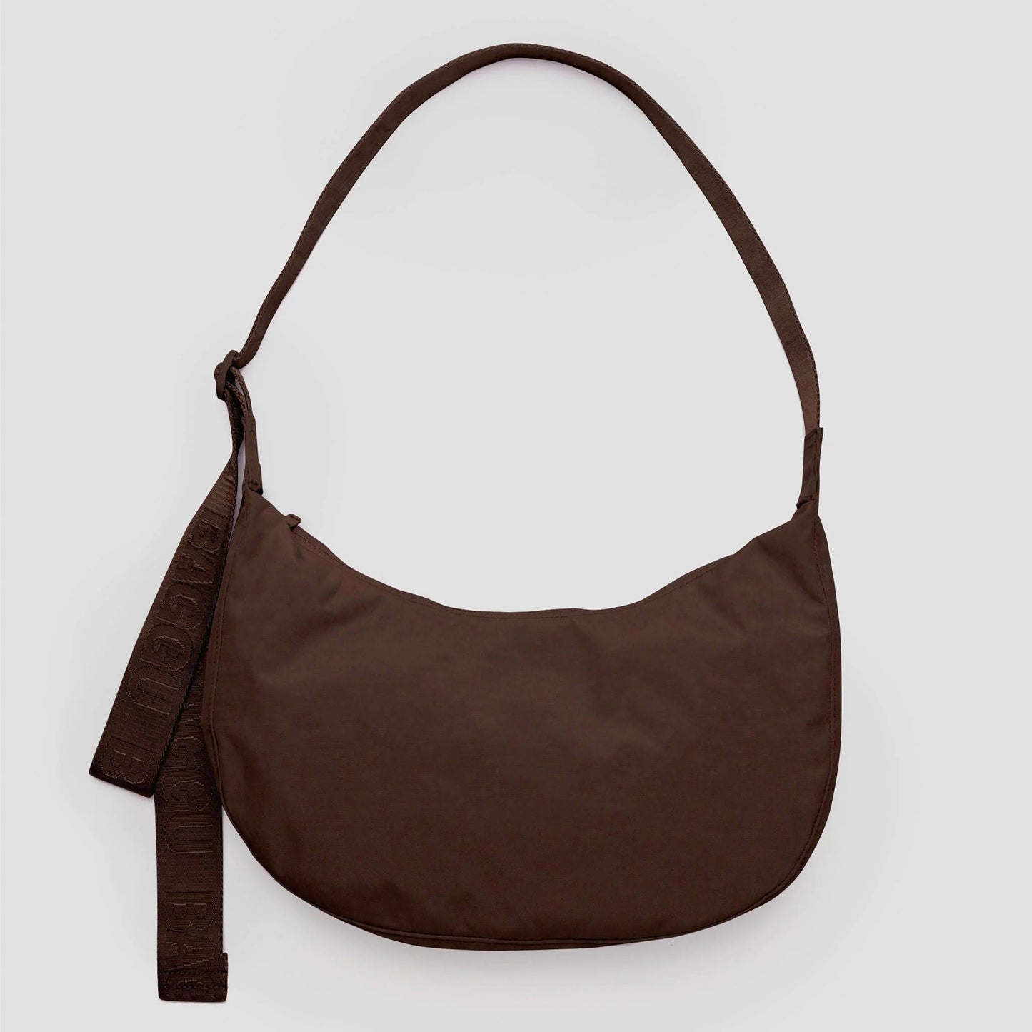 Brown shoulder bag on a light gray background