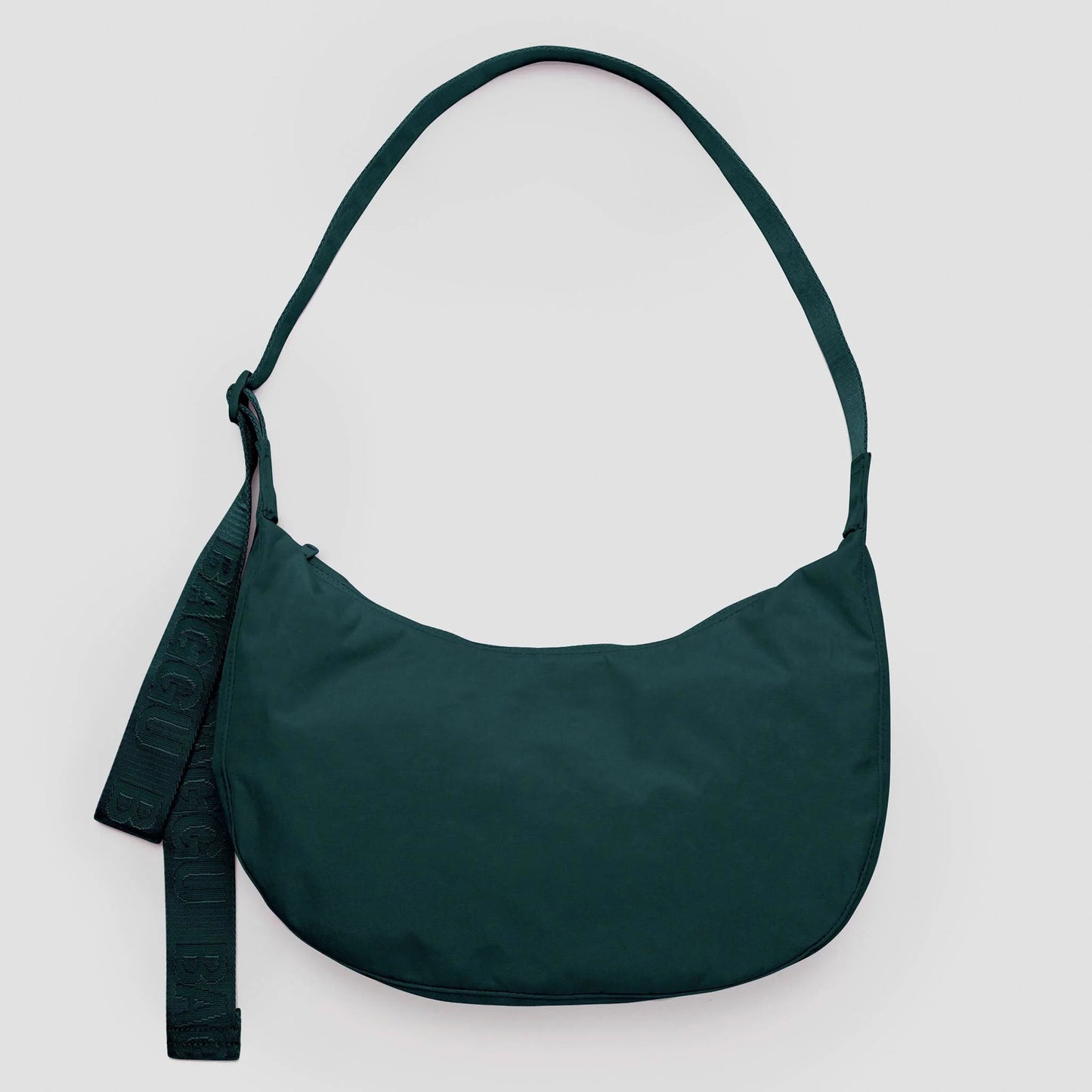 Green shoulder bag on a light gray background