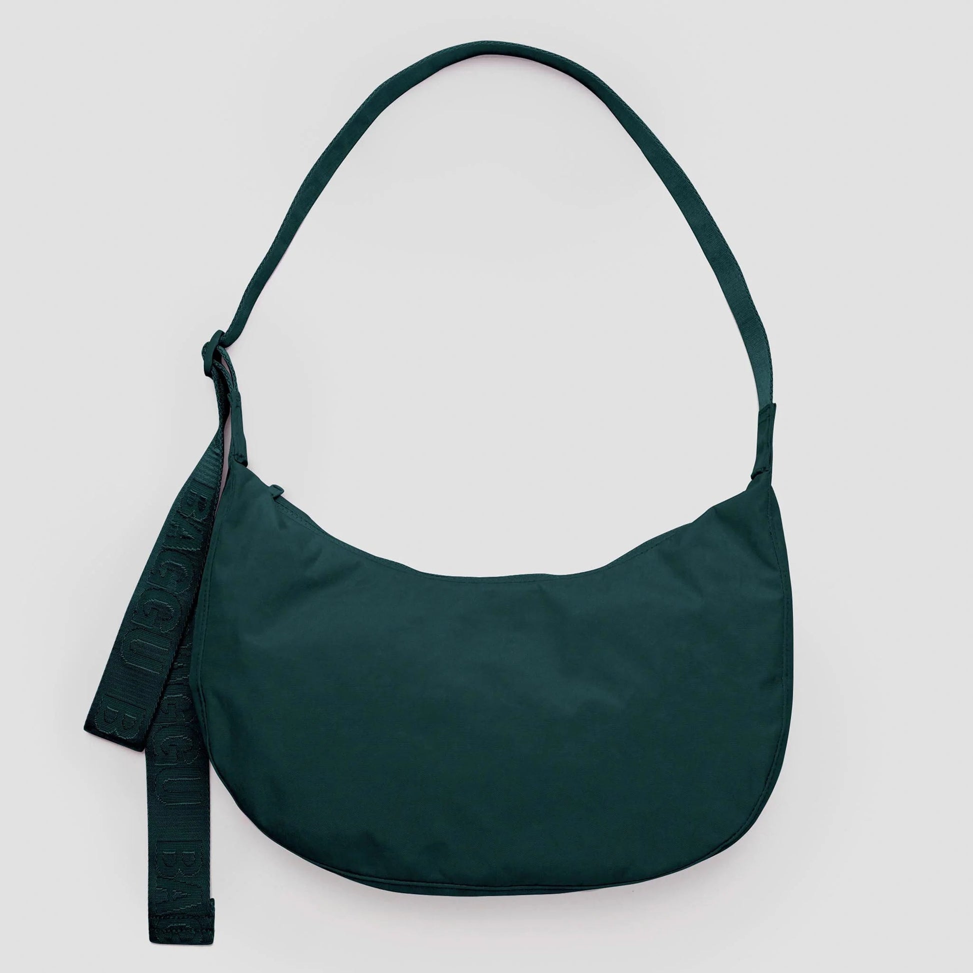 Green shoulder bag on a light gray background