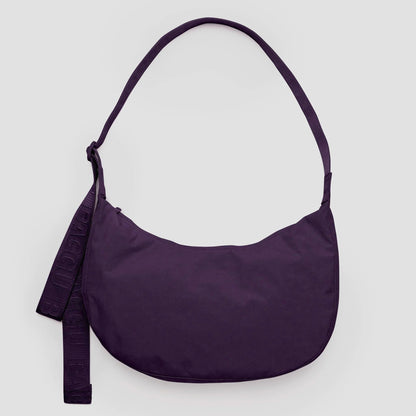 Purple shoulder bag on a light gray background