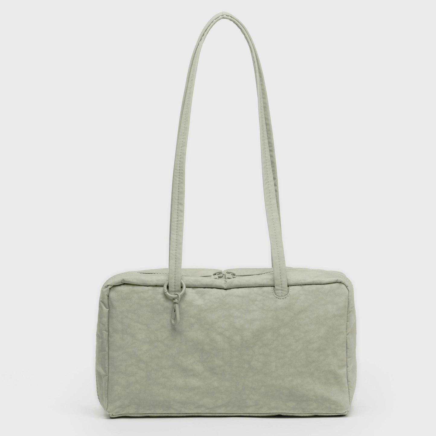 Light green handbag with a textured surface on a white background