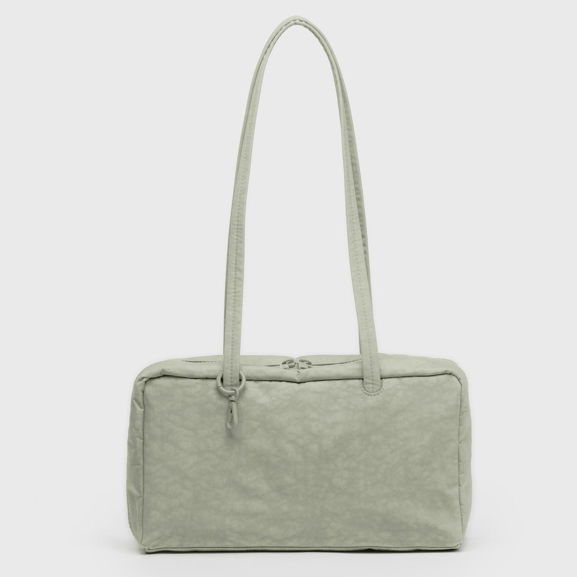 Light green handbag with a textured surface on a white background