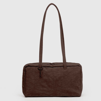 Brown nylon handbag with a strap on a light gray background