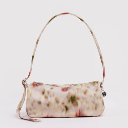 Floral nylon purse on a grey background.