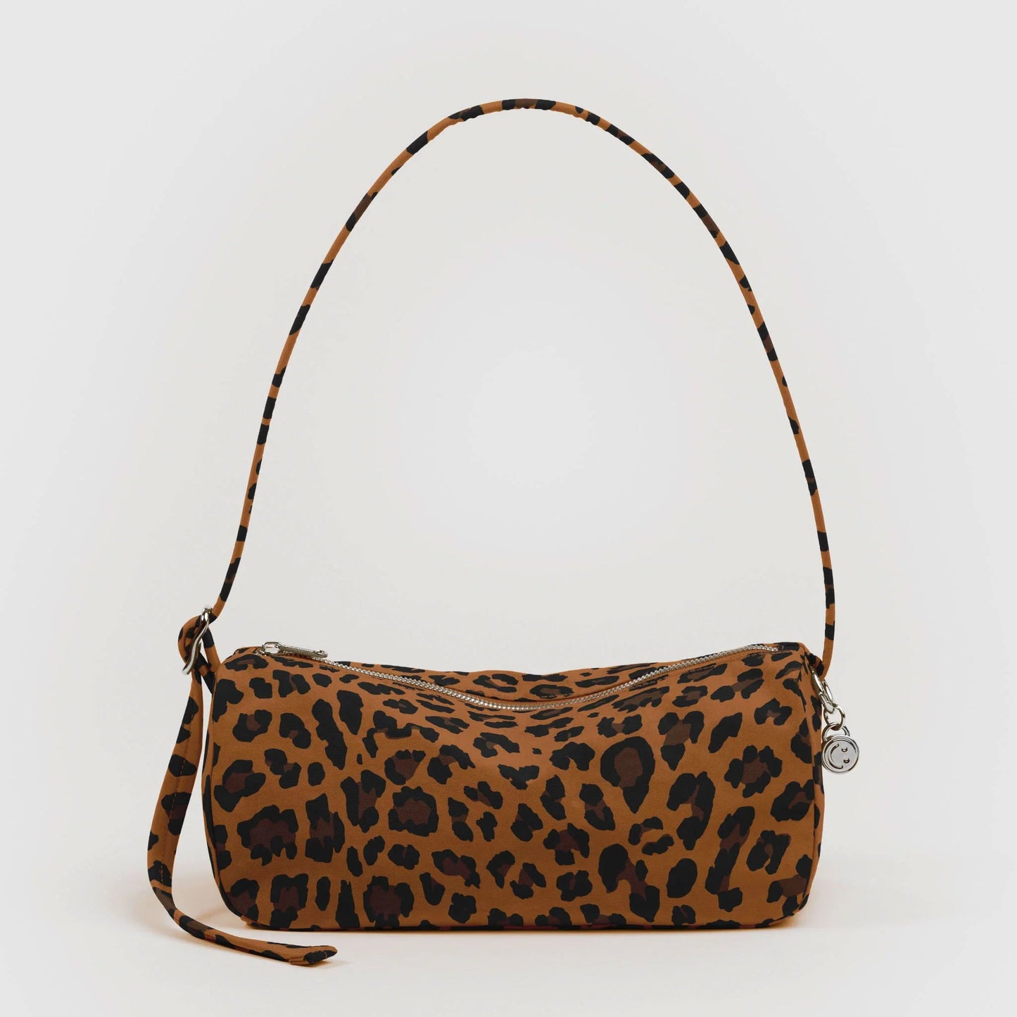 Leopard print handbag with a strap on a white background