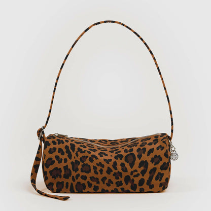 Leopard print handbag with a strap on a white background