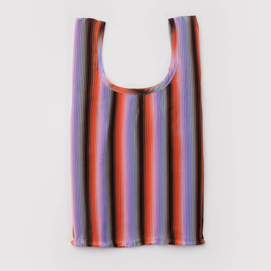 Multicolored striped  pleated nylon bag on a light gray background