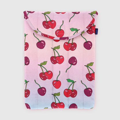 Pink laptop sleeve with cherry pattern on a light gray background