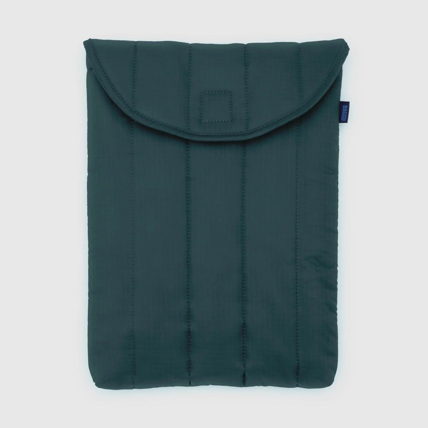 Green quilted laptop sleeve on a light gray background
