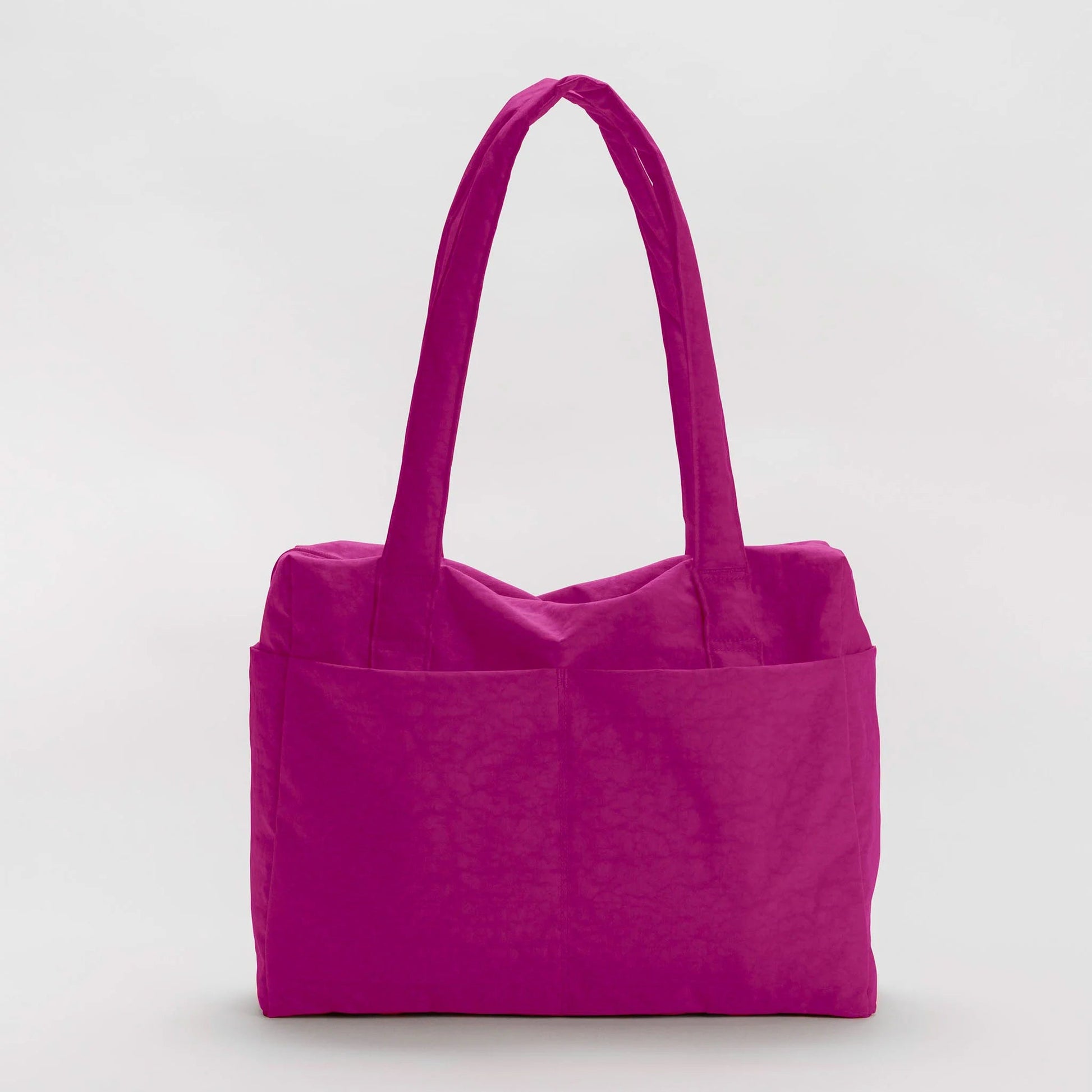 Fuchsia nylon tote bag on a light gray background