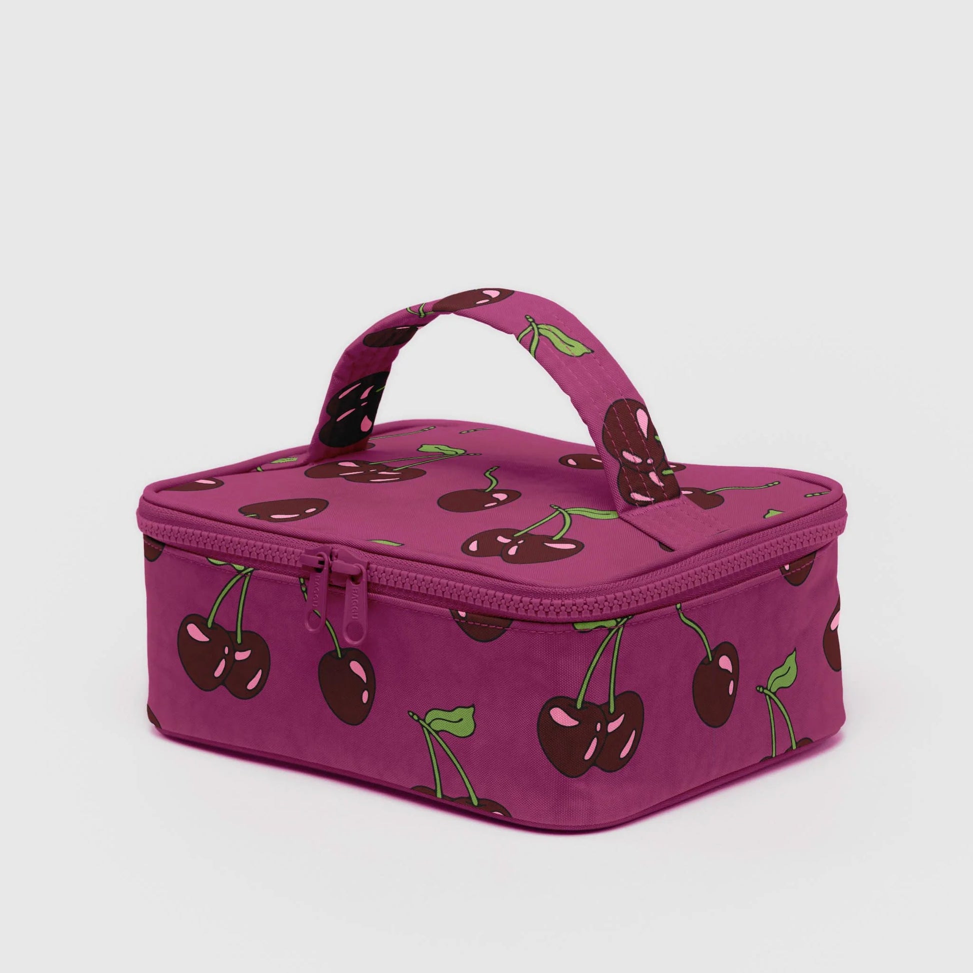 Purple cosmetic case with cherry pattern on a white background