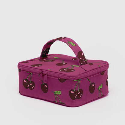 Purple cosmetic case with cherry pattern on a white background