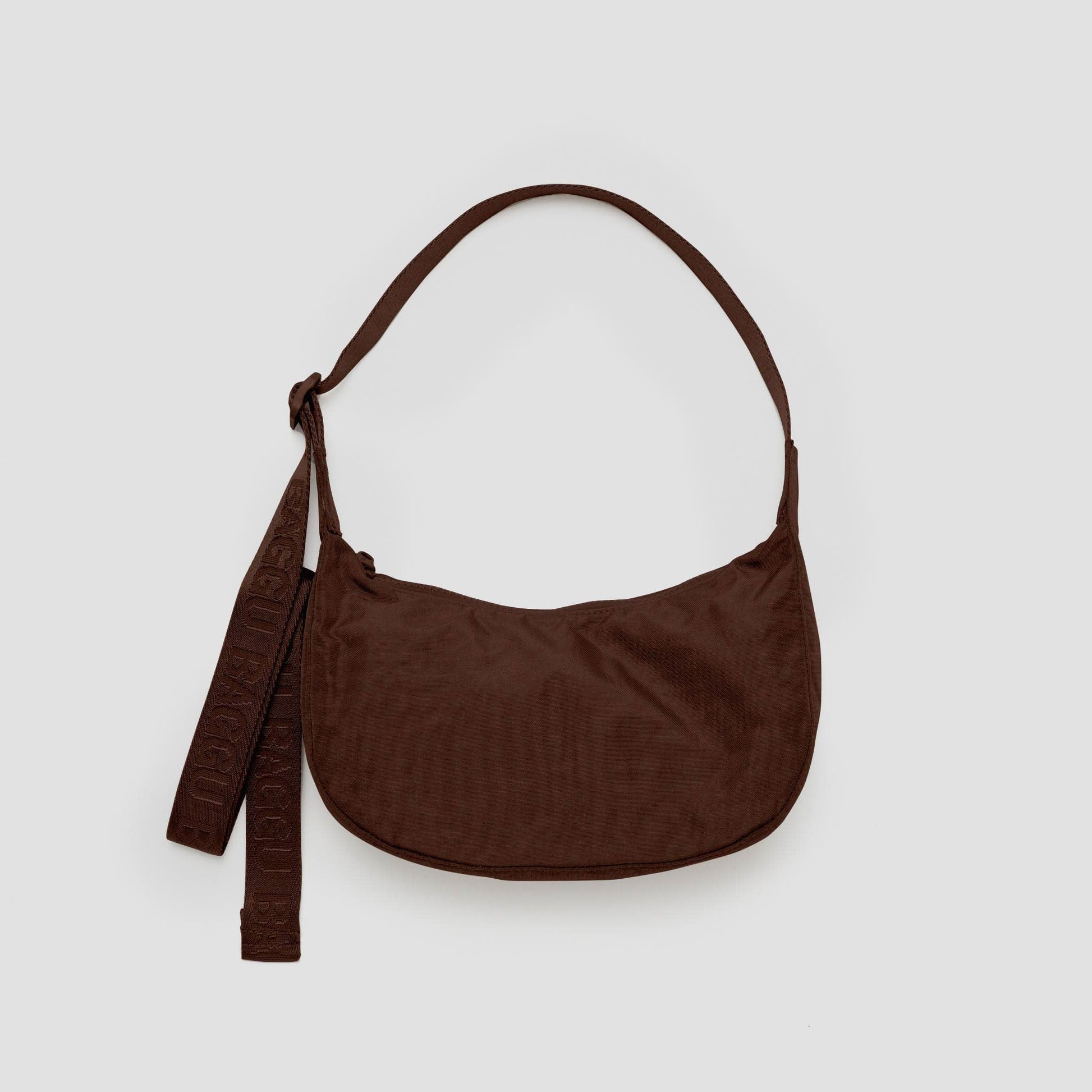 Brown shoulder bag on a light gray background