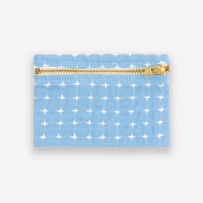 Light blue coin purse with a white cross stitch pattern, featuring a gold zipper.