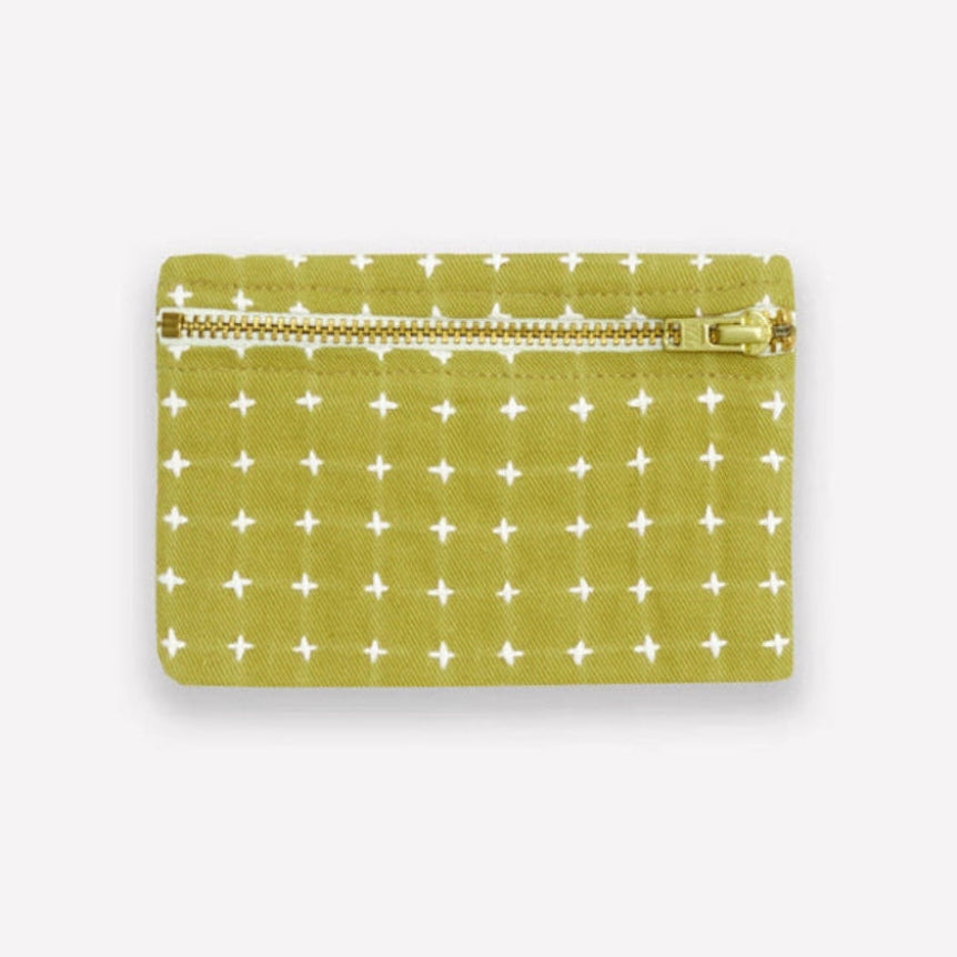 Green coin purse with white cross stitch pattern on a white background