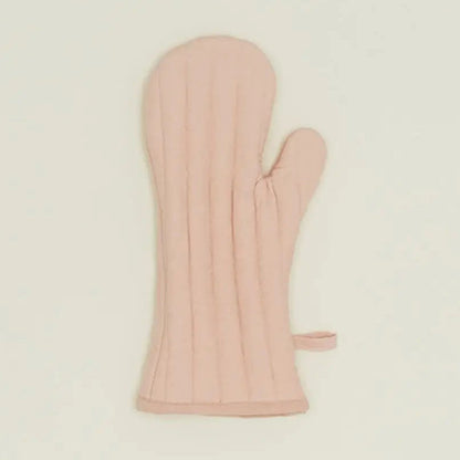 Pink oven mitt on a beige background
