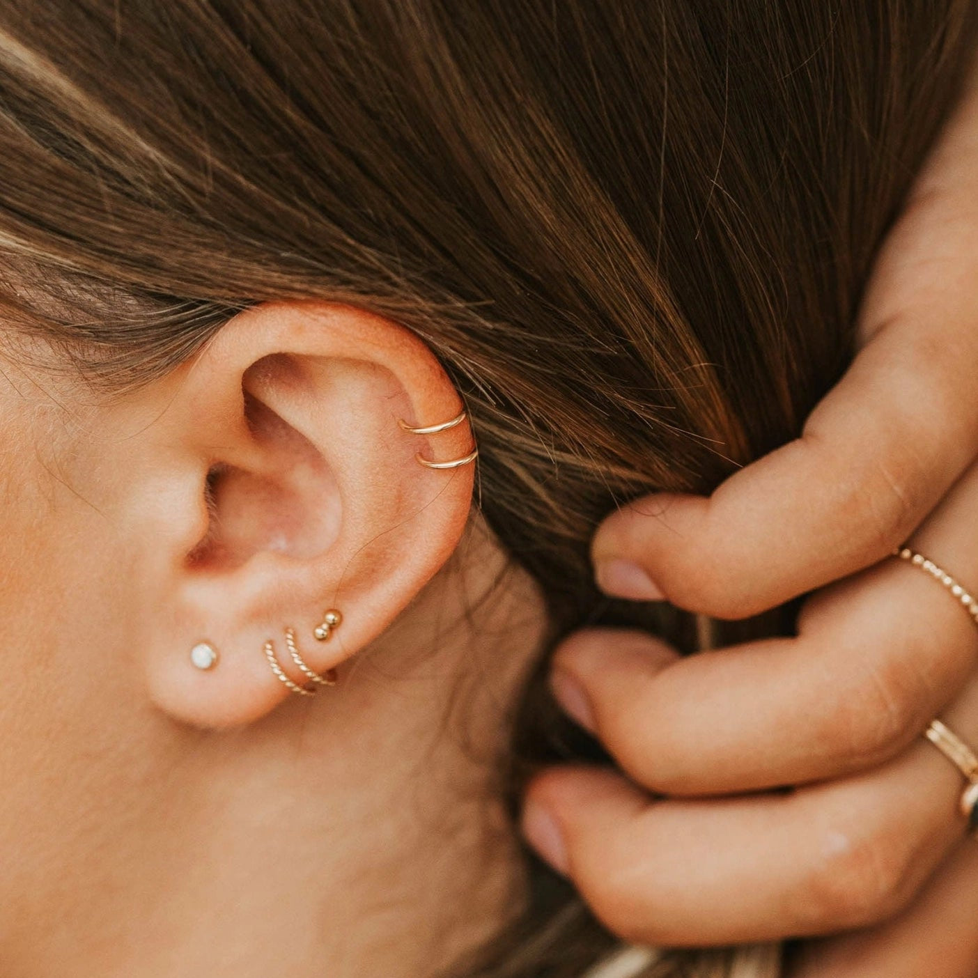 Simple cuff earrings on ear cartildge.
