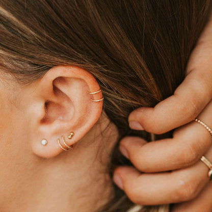 Simple cuff earrings on ear cartildge.