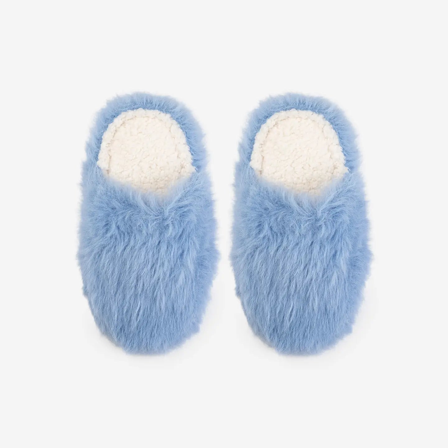 Pair of blue fuzzy slippers with white fleece interior on a white background