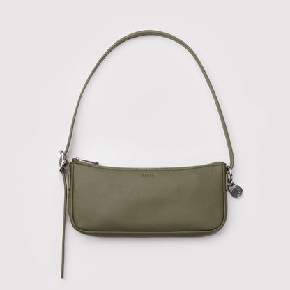 Green handbag with a strap on a white background