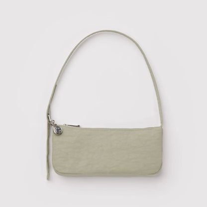 Light green handbag on a light gray background