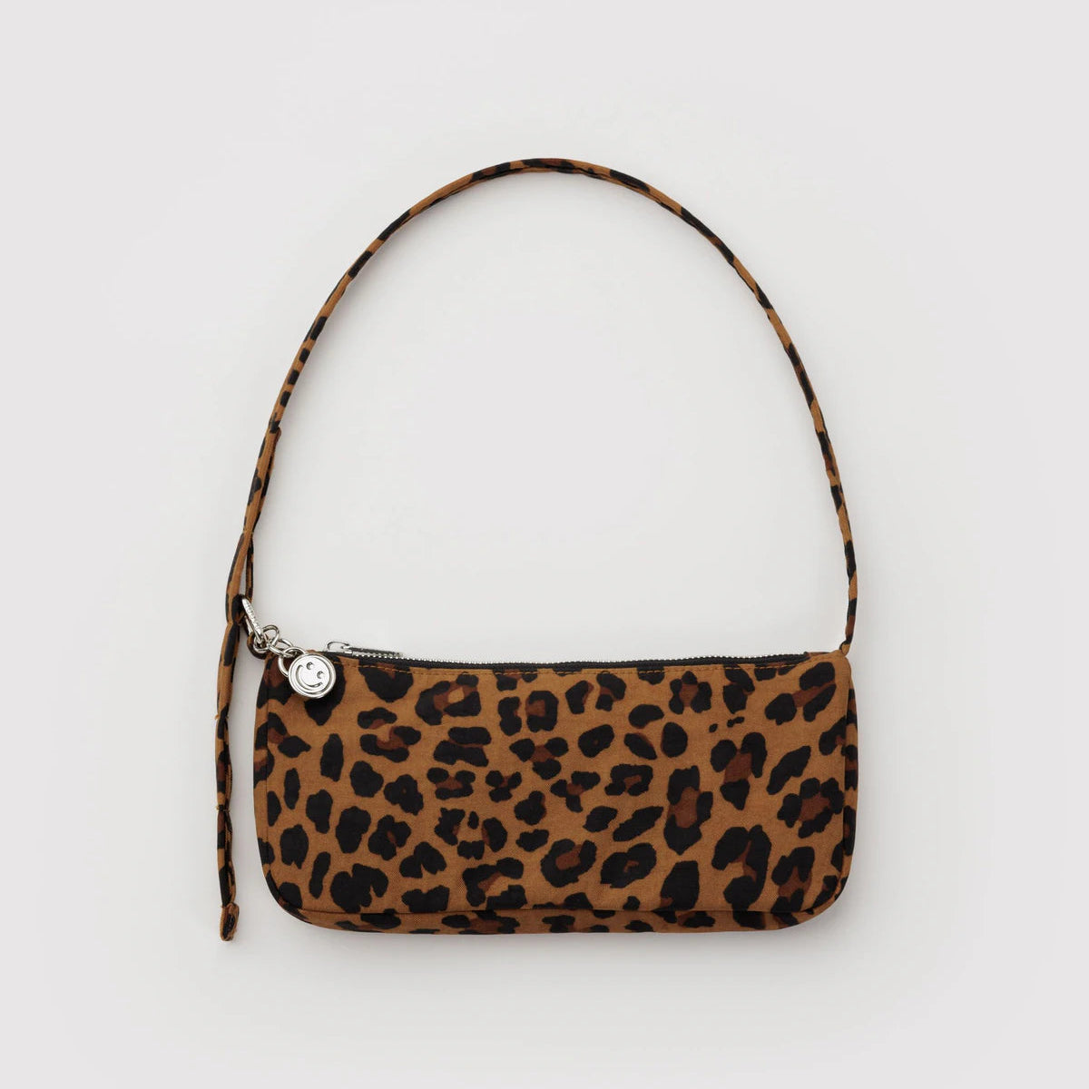 Leopard print handbag with a strap on a light gray background
