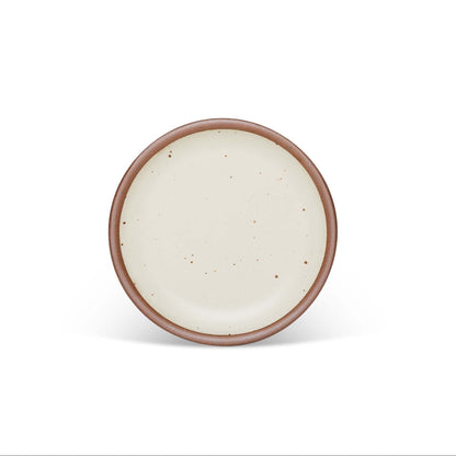 handmade ceramic side plate with a brown rim on a white background