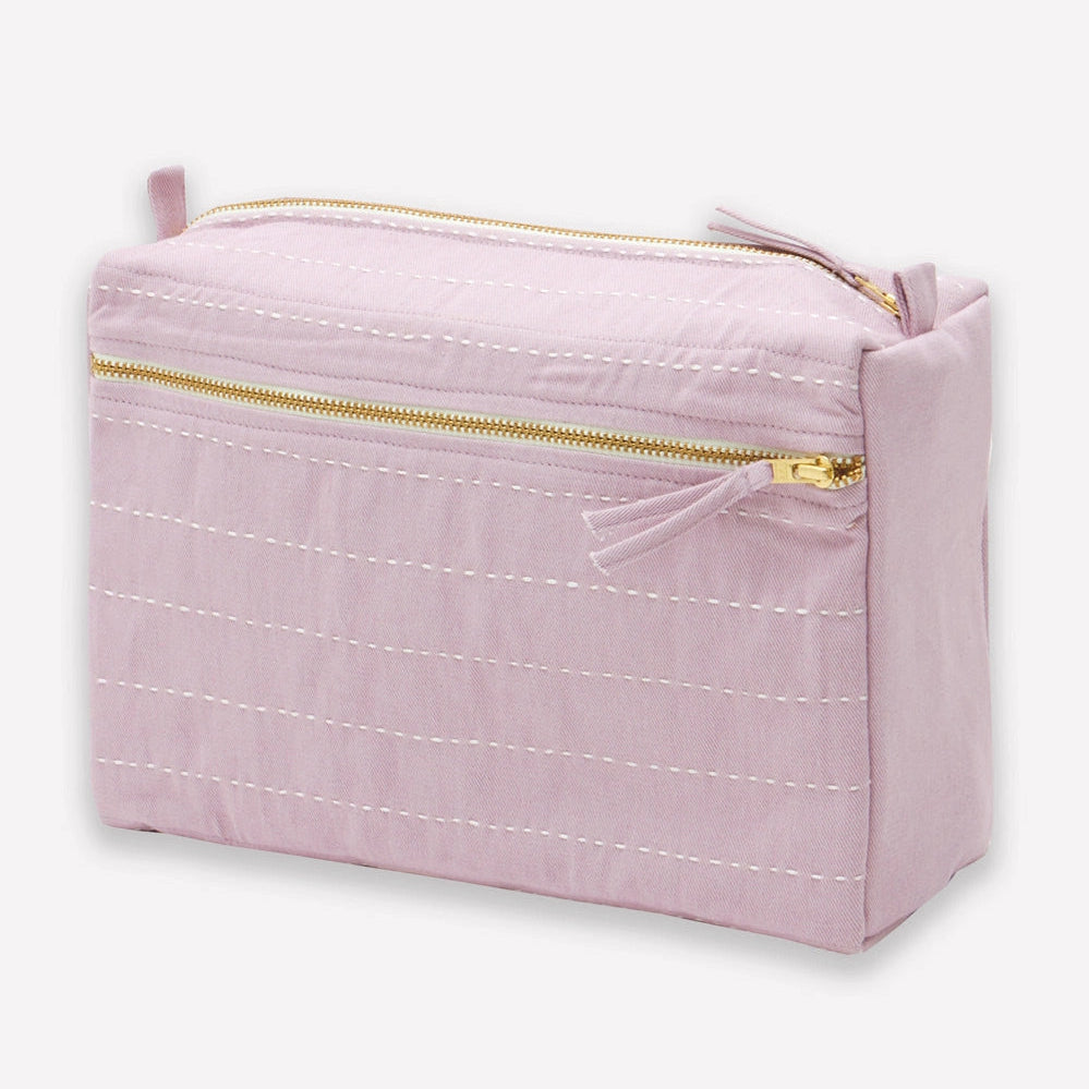 Lilac purple toiletry bag with gold zipper on a white background