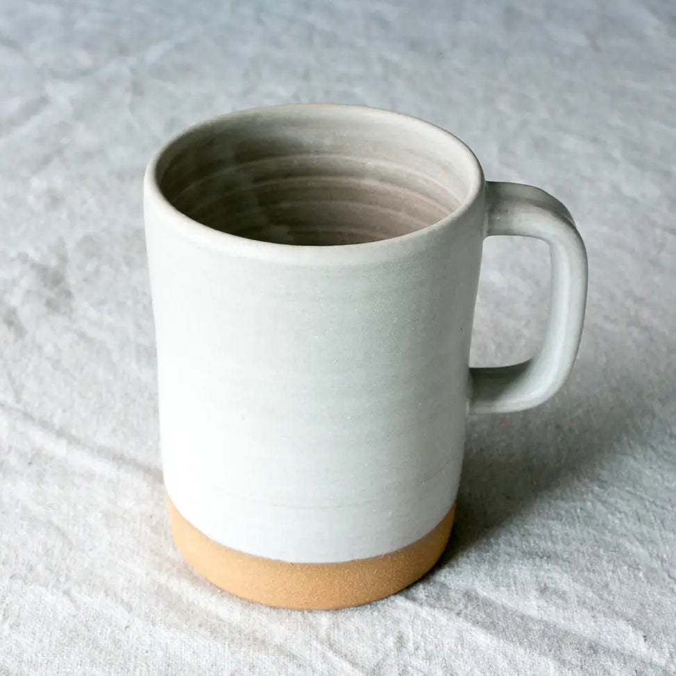 https://neighborlyshop.com/cdn/shop/products/handmade-ceramic-12-ounce-mug-matte-white.webp?v=1677167230&width=1445
