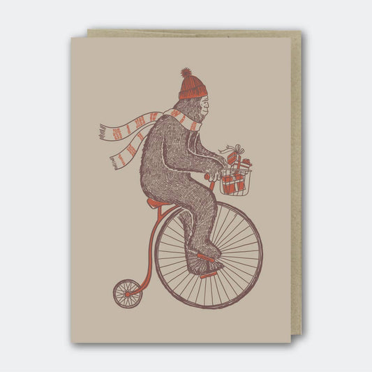 Sasquatch Riding a Bike with Gifts Holiday Card